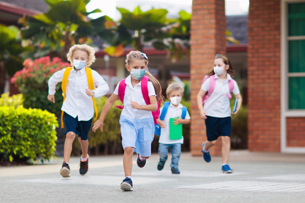 school child wearing face mask during corona virus and flu outbreak