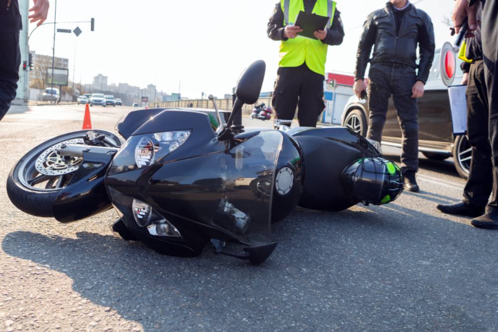 broken motorcycle on the road accident site